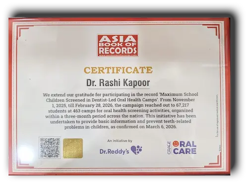 Asia Book of Records certificate awarded to Dr. Rashi Kapoor for the 'Maximum School Children Screened in Dentist-Led Oral Health Camps' initiative